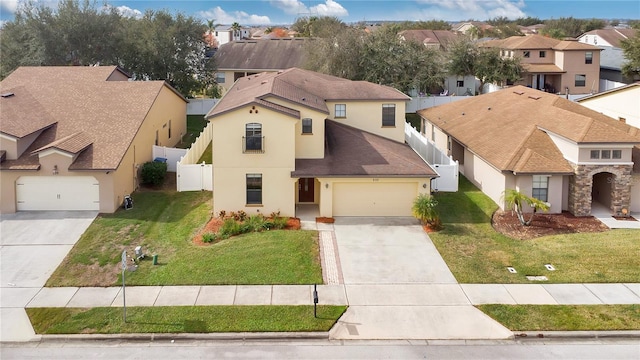 mediterranean / spanish-style house with a front yard and a garage