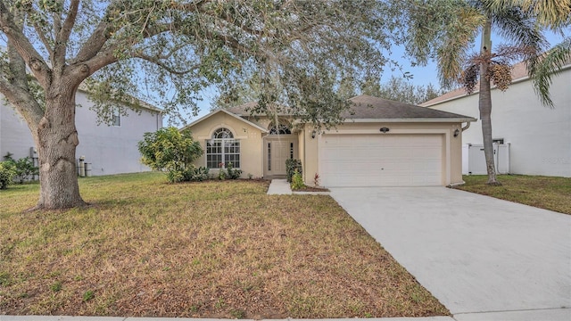 single story home with a garage and a front lawn