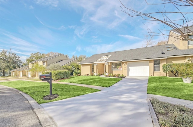 ranch-style house with a garage and a front lawn