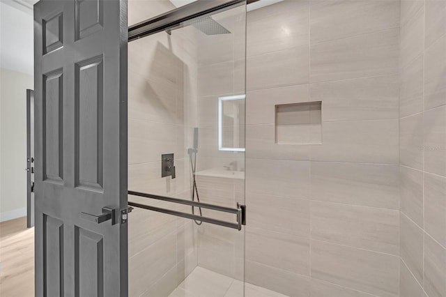 bathroom with a shower with shower door