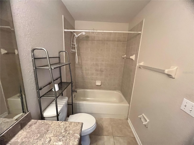 full bathroom featuring toilet, tile patterned floors, vanity, and tiled shower / bath combo