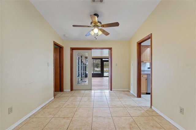 interior space featuring ceiling fan, french doors, and light tile patterned flooring