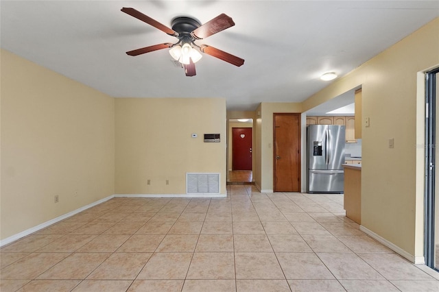 interior space with ceiling fan and light tile patterned floors