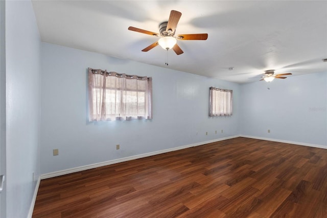 unfurnished room with ceiling fan and dark wood-type flooring