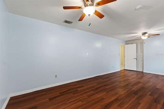 spare room featuring dark wood-type flooring