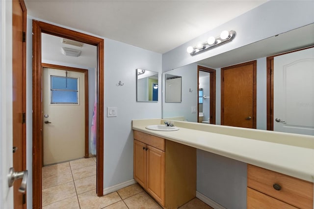 bathroom with vanity and tile patterned floors