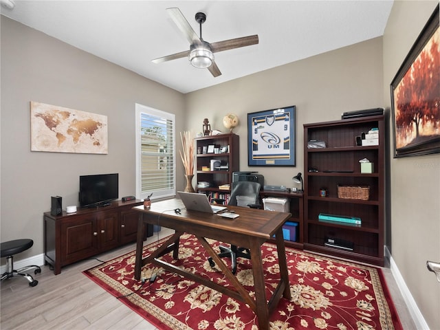 office featuring light wood-type flooring and ceiling fan