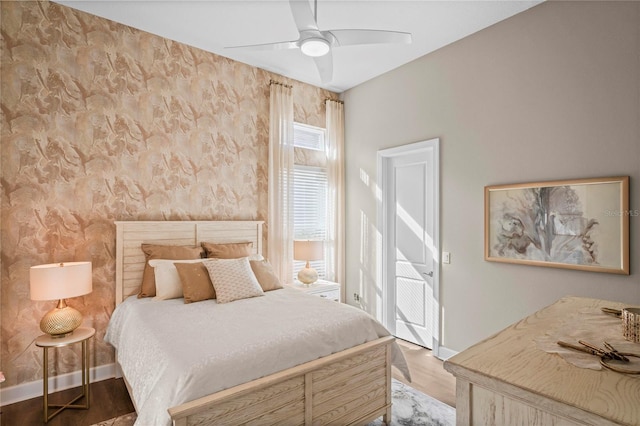 bedroom featuring ceiling fan and hardwood / wood-style flooring