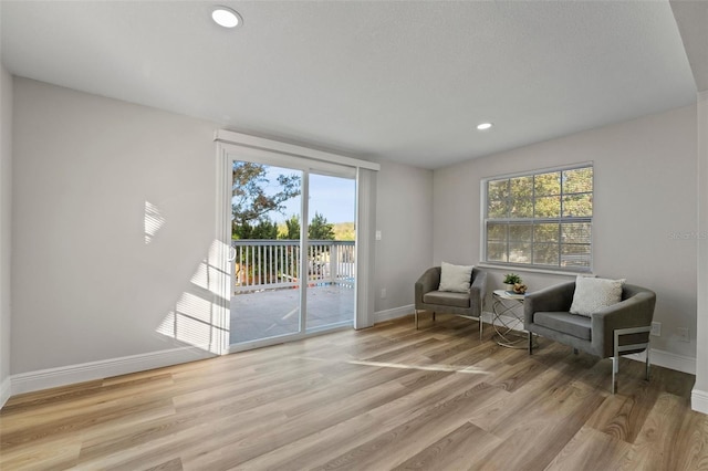 sitting room featuring light hardwood / wood-style flooring