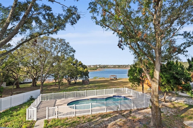 view of pool featuring a water view