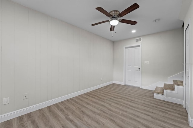 spare room featuring ceiling fan and light hardwood / wood-style floors