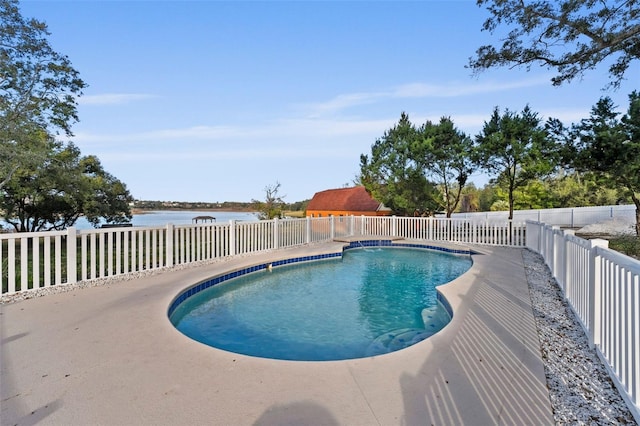 view of swimming pool with a water view