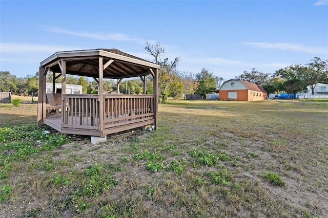 view of yard featuring a wooden deck and a gazebo