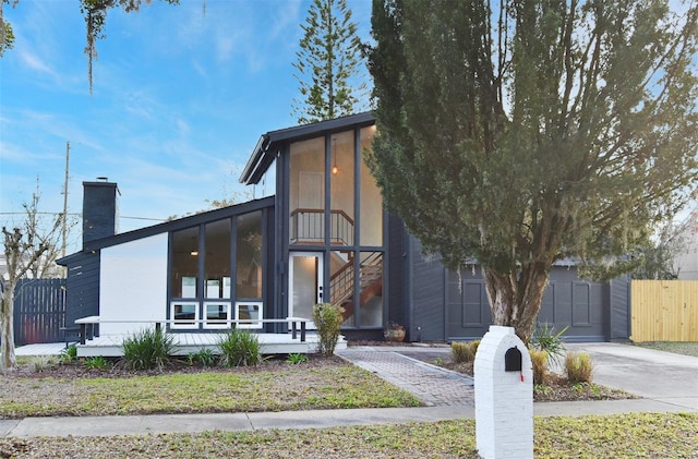 view of front facade featuring a sunroom