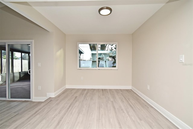 empty room with light hardwood / wood-style floors