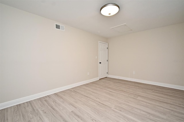 unfurnished room with light hardwood / wood-style floors