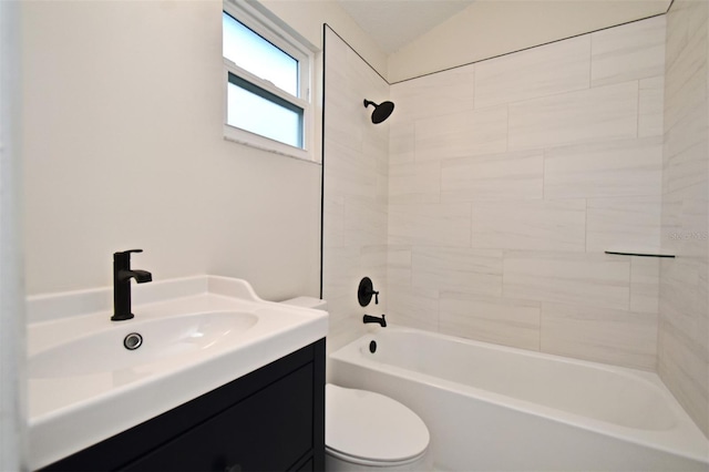 full bathroom featuring toilet, vanity, and tiled shower / bath combo