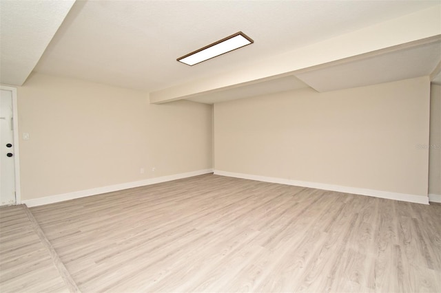 basement featuring light hardwood / wood-style flooring