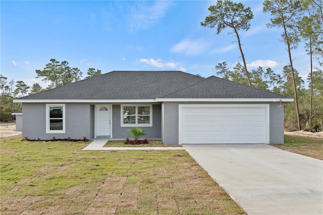 ranch-style home with a front yard and a garage