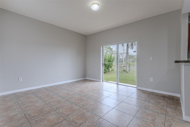 empty room with light tile patterned flooring