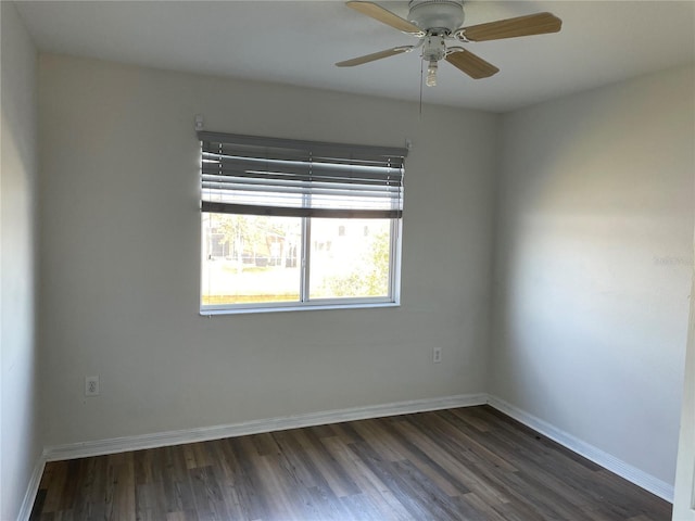 unfurnished room featuring ceiling fan and dark hardwood / wood-style floors