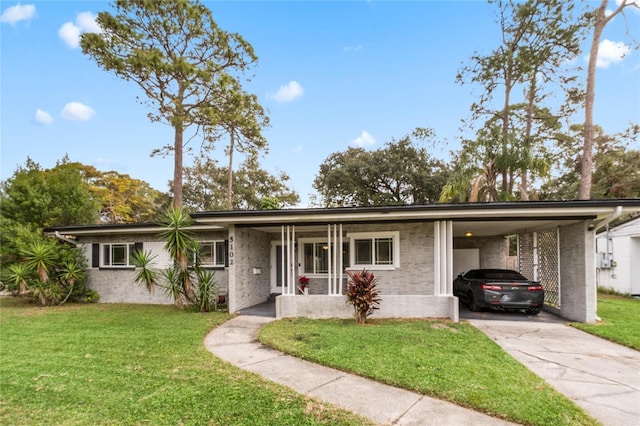 ranch-style house featuring a porch, a front yard, and a carport