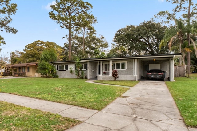 ranch-style home featuring a front yard and a carport