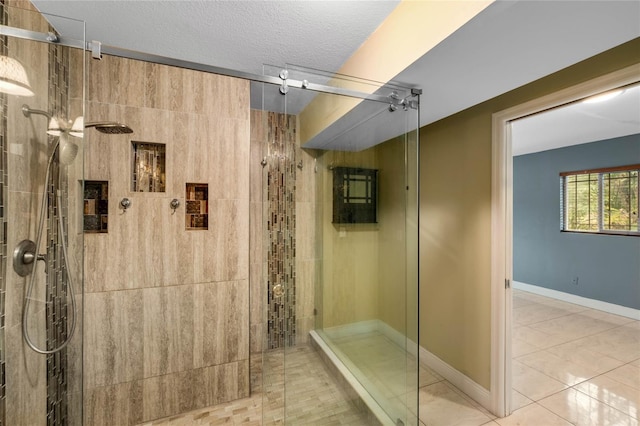 bathroom featuring a shower with door, a textured ceiling, and tile patterned floors