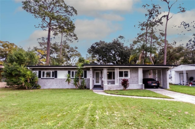 ranch-style house with a front yard and a carport