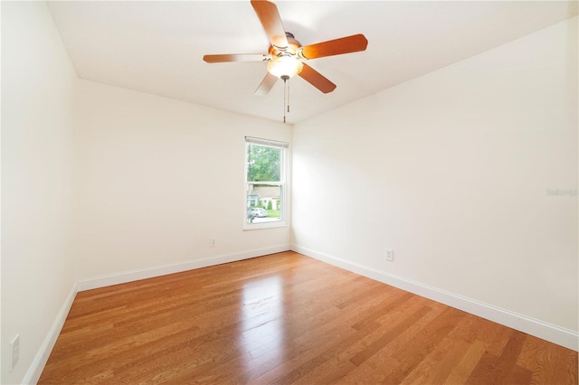 spare room featuring ceiling fan and wood-type flooring