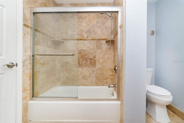 bathroom with toilet and enclosed tub / shower combo