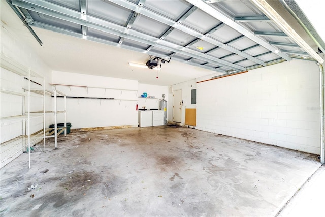 garage with a garage door opener, washer and dryer, and electric panel