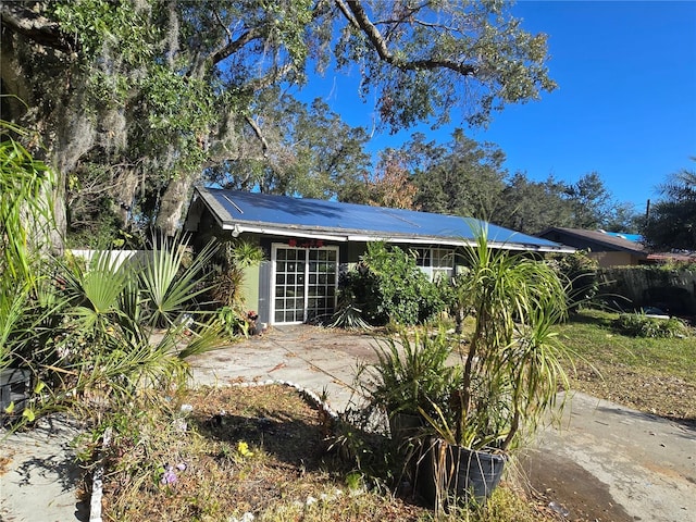 view of side of property with a patio area