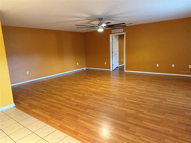 unfurnished room featuring ceiling fan and light hardwood / wood-style floors