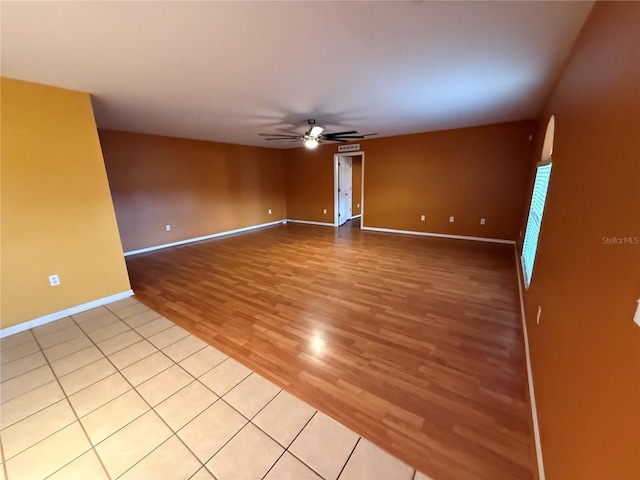 spare room with light hardwood / wood-style floors and ceiling fan