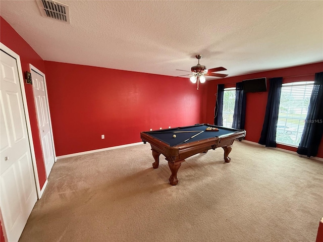 recreation room with pool table, a textured ceiling, ceiling fan, and carpet flooring