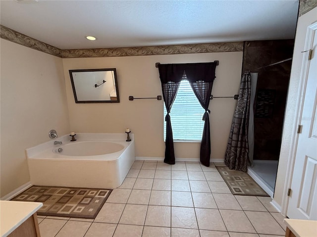 bathroom featuring separate shower and tub and tile patterned flooring