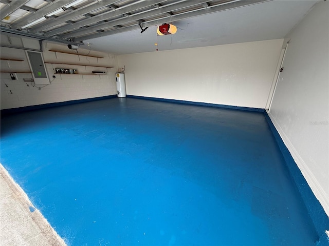 garage featuring a garage door opener, electric panel, and water heater