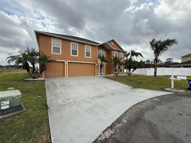 view of front of house featuring a garage and a front lawn