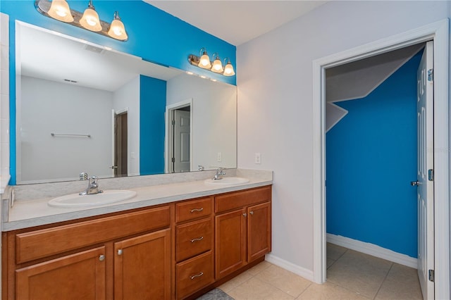 bathroom featuring vanity and tile patterned flooring