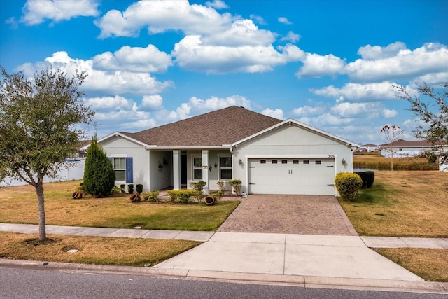 ranch-style home with a garage and a front yard