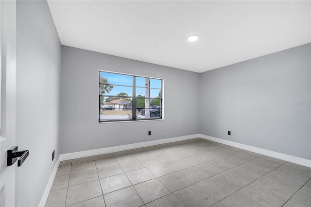 empty room with light tile patterned floors