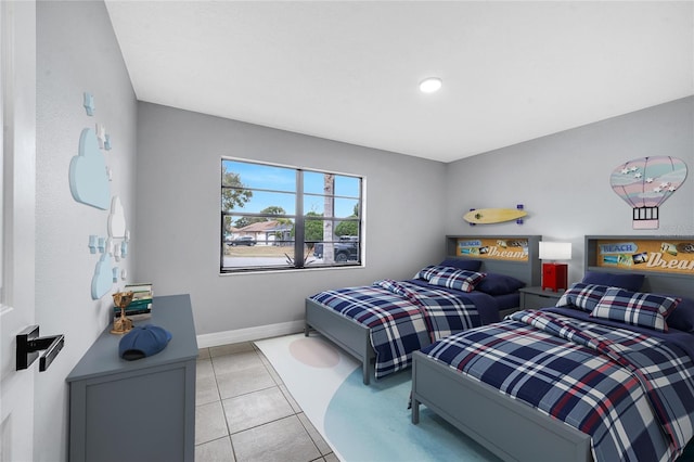 bedroom with light tile patterned floors