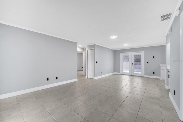 unfurnished room featuring light tile patterned floors, crown molding, and french doors