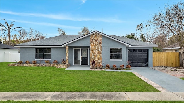 ranch-style home featuring a garage and a front lawn