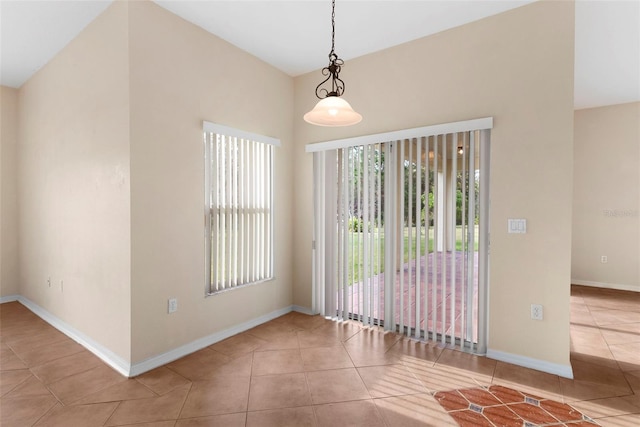 unfurnished room featuring tile patterned flooring