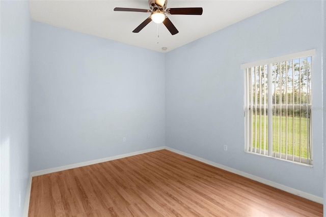 empty room featuring ceiling fan and light hardwood / wood-style floors