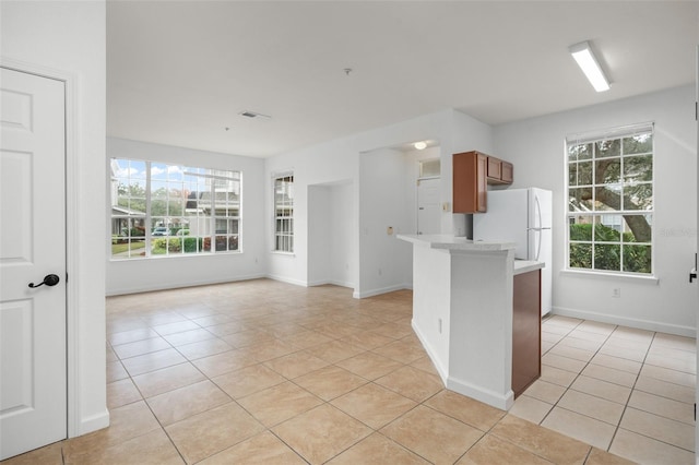 kitchen featuring light tile patterned flooring