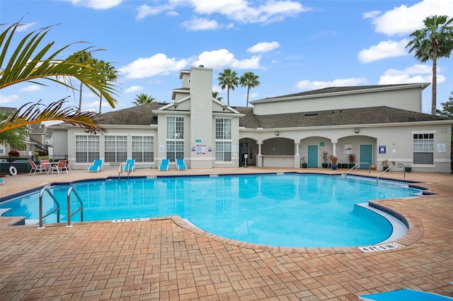 view of swimming pool with a patio