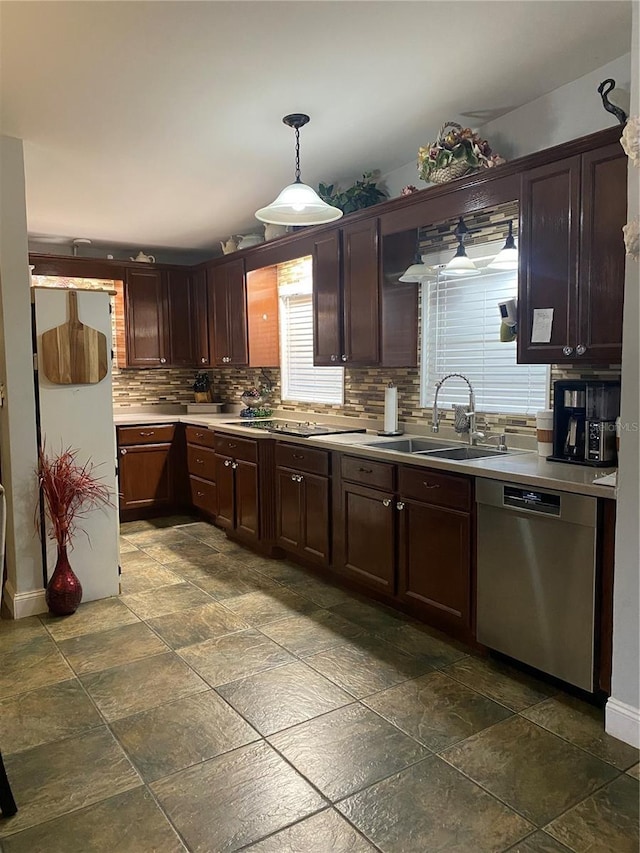 kitchen featuring pendant lighting, dishwasher, dark brown cabinetry, and sink